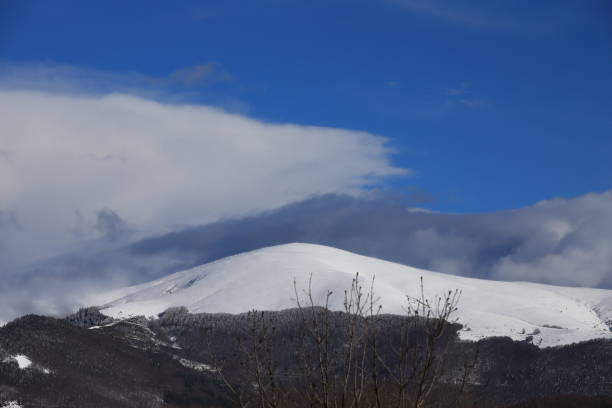 istock Snow-covered mountain in the Pyrenees covered with clouds,  France 1050666026