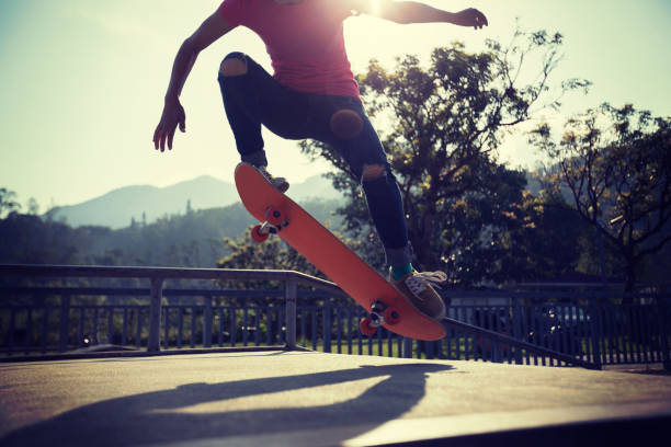 istock Skateboarder skateboarding at skatepark 1050673502