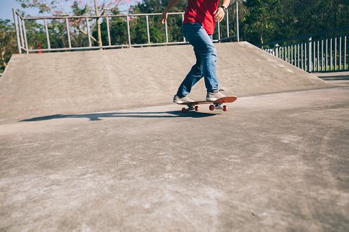 Skateboarder skateboarding at skatepark