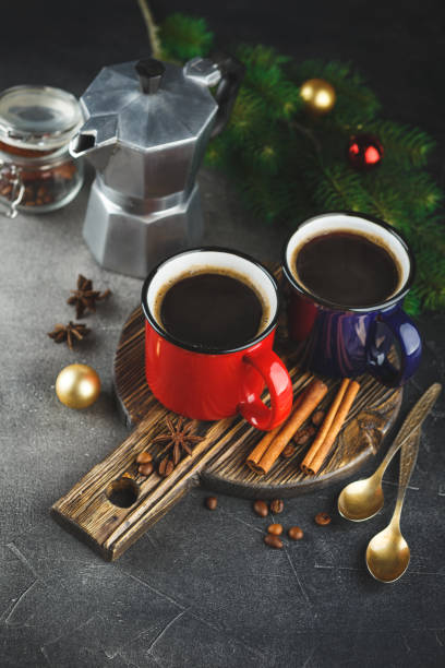 istock Winter coffee with spices in color enamelled cups 1050677092