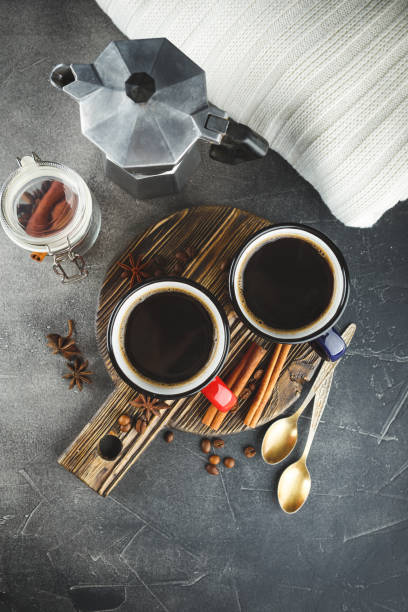 istock Winter coffee with spices in color enamelled cups 1050677128