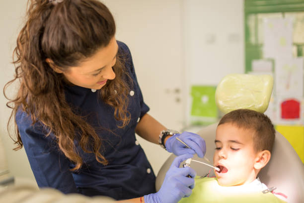 istock Little boy at regular dental check-up 1050677286