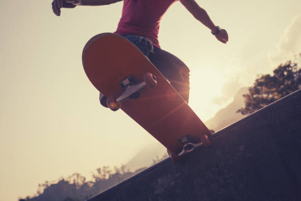 istock Skateboarder skateboarding at skatepark 1050679862