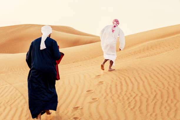 istock Following the younger brother while having fun at the sand dunes 1050680510