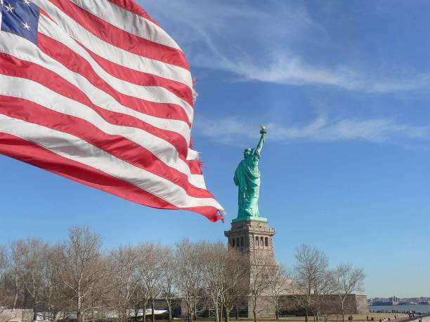 istock Statue of Liberty (With Flag) 1050683132