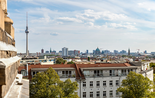 wide panoramic view on the cityscape with tv-tower under blue sky