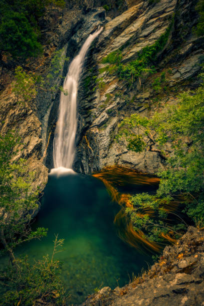 istock Incredible high waterfall falling through the cliffs on Fonias river on Samothrace island in Greece in abeautiful natural landscape 1050692426