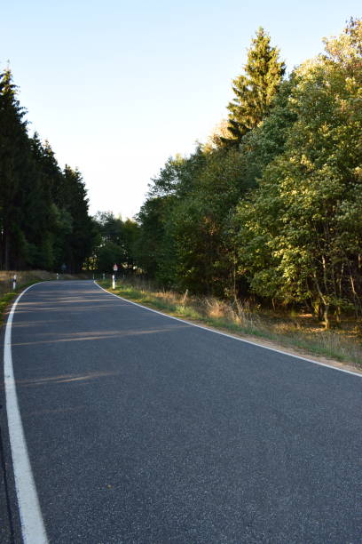 istock autumn road through Bergheide Eifel 1050696284