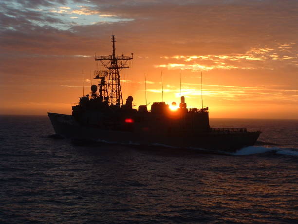 Refueling at sea with the HMAS Adelaïde Sunset after the refueling of the HMAS Adelaïde australian navy stock pictures, royalty-free photos & images