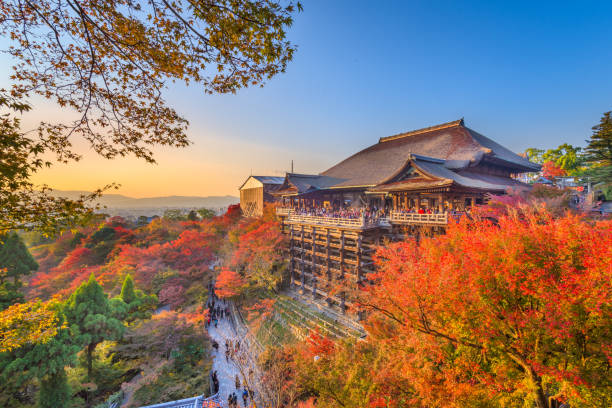 Kyoto, Japan at Kiyomizu-dera Temple Kyoto, Japan - November 30, 2015: Visitors enjoy  Kiyomizu-dera during the autumn seasons. The temple was complete in the year 778 and is a UNESCO World Heritage Site. shinto photos stock pictures, royalty-free photos & images