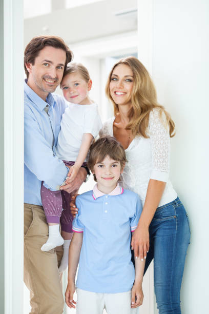 istock Happy family in doorway 1050703202