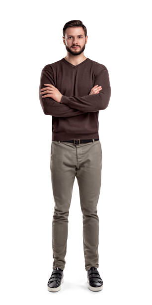 istock A bearded man in casual garb stands in front view with folded arms and neutral face expression. 1050705862