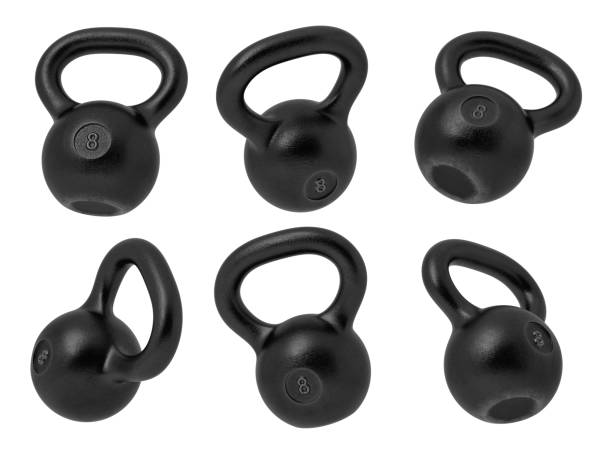 istock 3d rendering of 8 kg several black iron kettlebells hanging at different angles on a white background. 1050706184