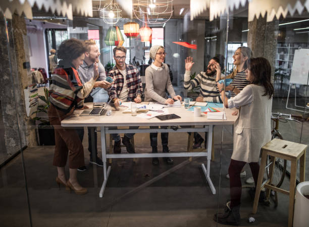 istock Large group of playful creative people having fun at casual office. 1050709528