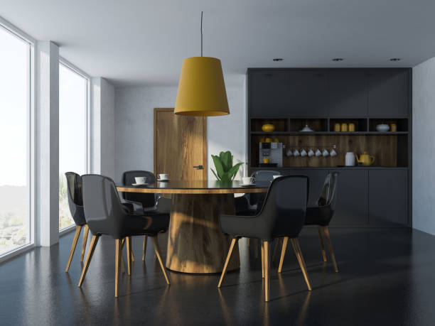 istock Cozy black and wooden dining room interior 1050709780