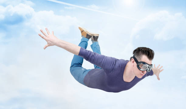 istock Crazy man in goggles is flying in the cloudy sky. Jumper concept 1050712488