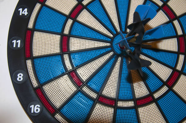 istock Dartboard with darts in the center 1050713308