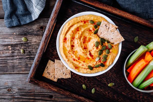 istock Homemade Savory Pumpkin Hummus . Thanksgiving Appetizer dip 1050715792
