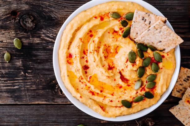 istock Homemade Savory Pumpkin Hummus . Thanksgiving Appetizer dip 1050715952