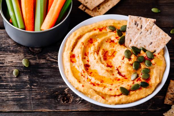 istock Homemade Savory Pumpkin Hummus . Thanksgiving Appetizer dip 1050715974