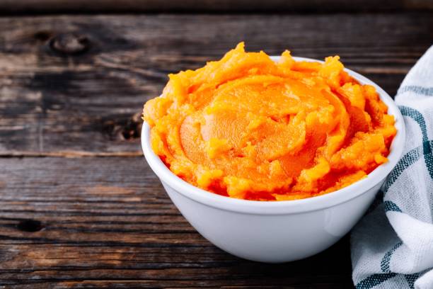 istock Organic Orange Pumpkin Puree. Baked butternut squash. 1050716270