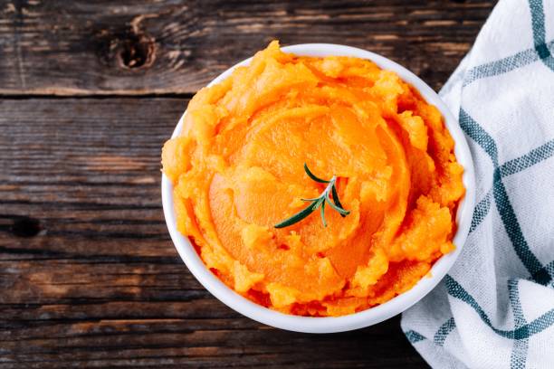 istock Organic Orange Pumpkin Puree. Baked butternut squash. 1050716306