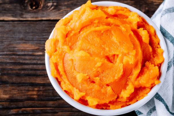 istock Organic Orange Pumpkin Puree. Baked butternut squash. 1050716378