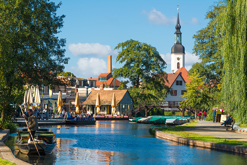 Lübbenau Cottbus, Germany - September 25. 2018 - The big harbor in Luebbenau, Spreewald. The pretty town is the center of tourism and the starting point of the famous rides with boat and paddle boat through the Spreewald and its small rivers through the forest. Many tourists meet here and explore nature.
