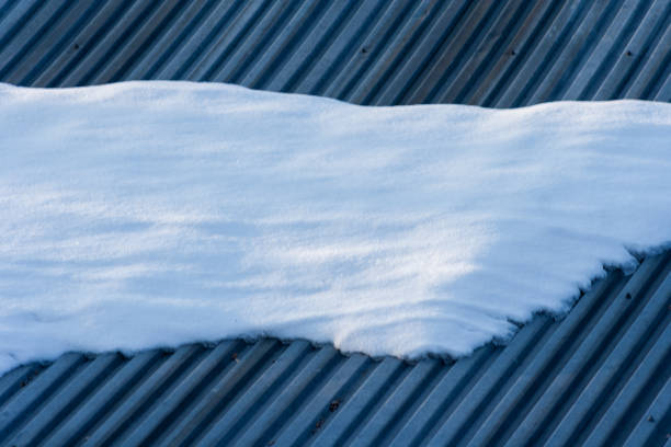 istock Sheet roof covered with snow 1050726640