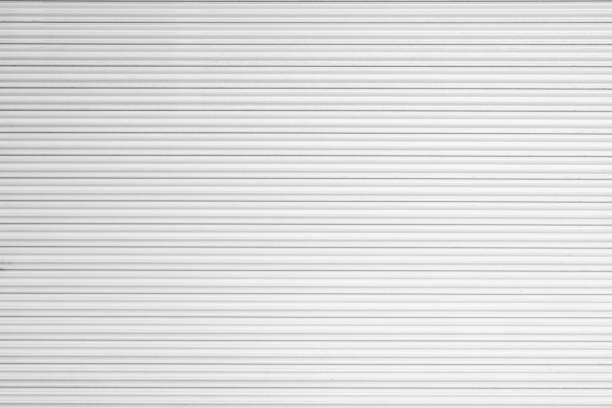 istock corrugated metal sheet,white Slide door ,roller shutter texture 1050729938