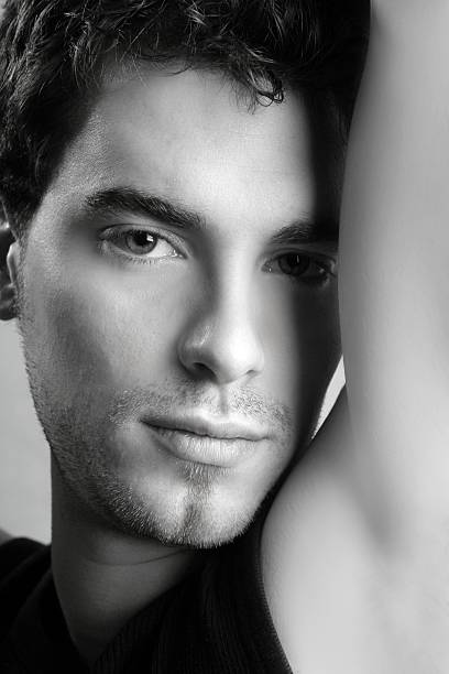 istock black and white young man face portrait 105073174