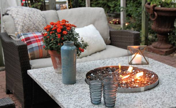 Outdoor seating arrangement Outdoor seating arrangement around a gas fire pit table in the fall fire pit photos stock pictures, royalty-free photos & images