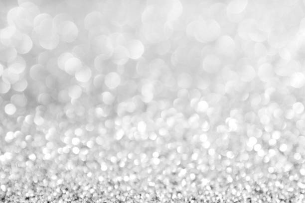 istock abstract background white Silver lights on christmas bokeh 1050735856