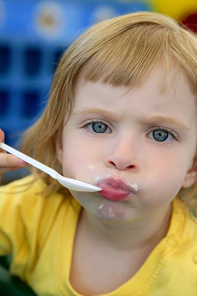 istock Blond little girl eating and gesturing 105073754