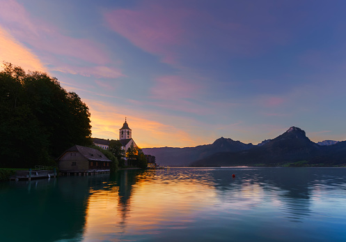 Beautiful scenery of Pilgrimage Church of St. Wolfgang on the northern shore of Lake Wolfgang in the morning , Austria