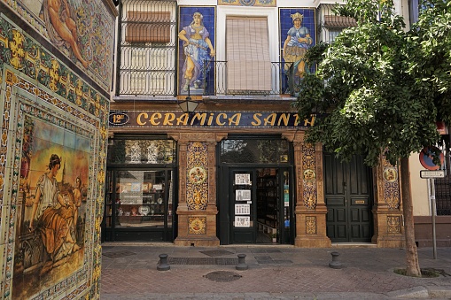 Seville, Spain - September 19, 2018: A quiet corner in the Triana neighborhood featuring a couple of large ceramics shops and the ceramics museum.