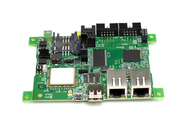 istock Electronic printed circuit board with chips and other components, green color, front view, isolated on white background 1050748950