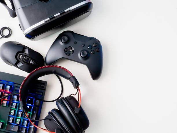 istock gamer workspace concept, top view a gaming gear, mouse, keyboard, joystick, headset and mouse pad on white table background. 1050752676