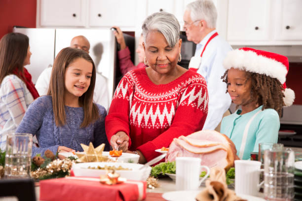 istock Multi-ethnic family in home kitchen preparing Christmas dinner. 1050753030
