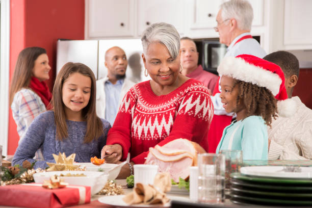 istock Multi-ethnic family in home kitchen preparing Christmas dinner. 1050753044