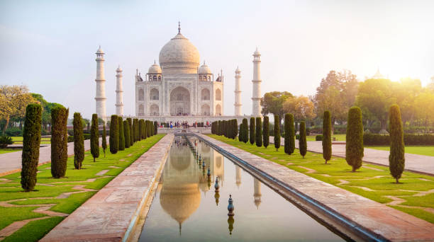 istock Sun rise at Taj Mahal front view reflected on the reflection pool. 1050754140