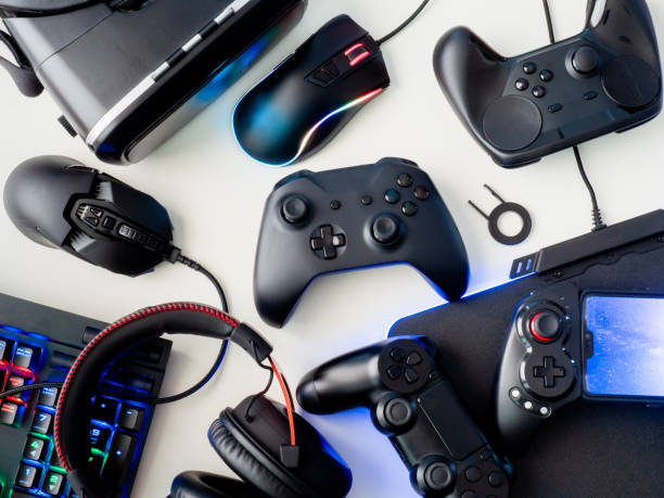 istock gamer workspace concept, top view a gaming gear, mouse, keyboard, joystick, headset and mouse pad on white table background. 1050763638