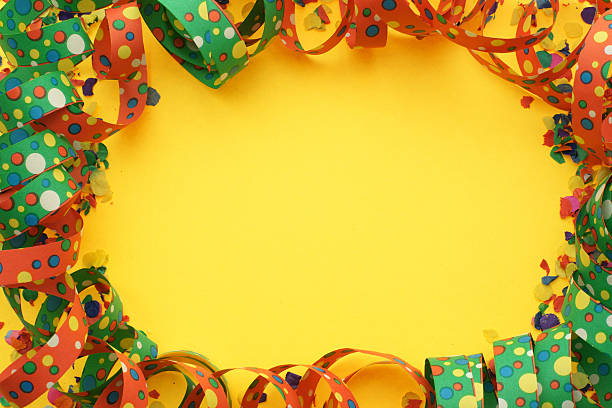 Party time Confetti and ribbons on a yellow background partytime stock pictures, royalty-free photos & images