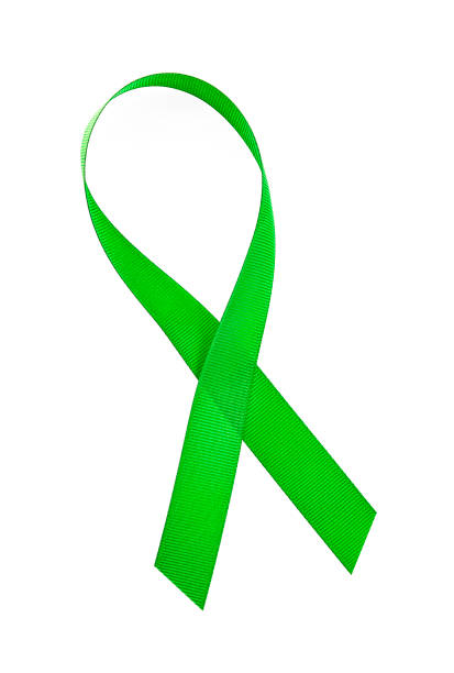 istock Green awareness ribbon isolated on a white background 1050769314