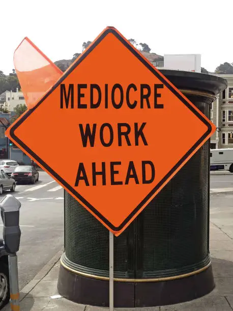 Photo of MEDIOCRE WORK AHEAD Sign