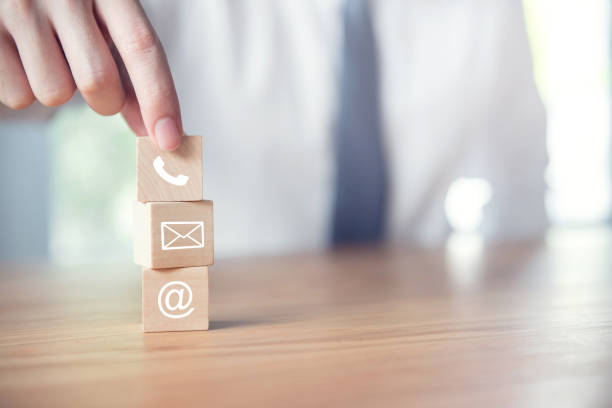 istock CONTACT US, Businessman hand holding ( mail,phone,email ) icon. cutomer support concept 1050774800