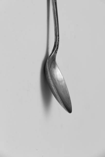 istock teaspoon closeup. black and white photo 1050777076