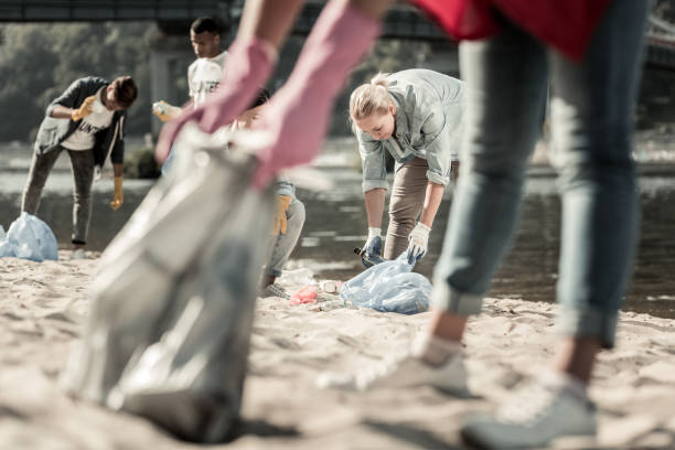 istock Family spending their weekend on the beach while participating in voluntary work 1050789520