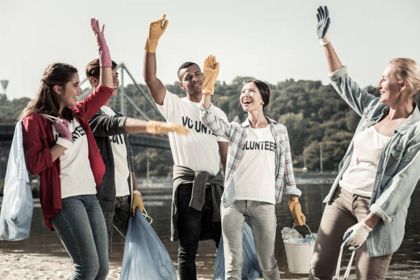 istock Team of active volunteers feeling cheerful and inspired while working together 1050789588