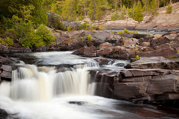 istock Small waterfalls in a rocky river, northern landscape. 105079063